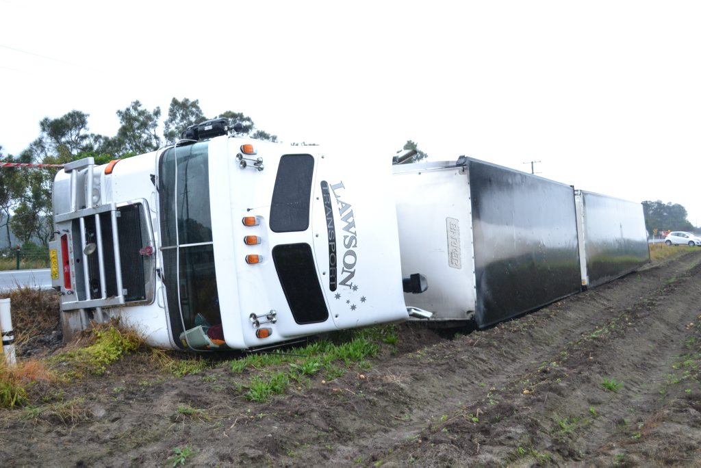 The Pacific Highway at Wardell is closed today as emergency services salvage this truck that rolled over during the night. The Pacific Highway at Wardell is closed today as emergency services salvage this truck that rolled over during the night.