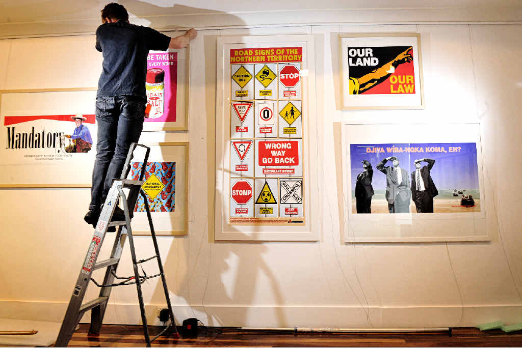 GOING UP: Dean Beletich installs a new exhibit at the Lismore Regional Gallery examining years of artistic activism. GOING UP: Dean Beletich installs a new exhibit at the Lismore Regional Gallery examining years of artistic activism.