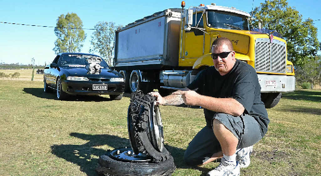 BLAZING PASSIONS: Truck driver Kimber with his two loves, his burnout ute Vicious and the tipper he drives for work. BLAZING PASSIONS: Truck driver Kimber with his two loves, his burnout ute Vicious and the tipper he drives for work.