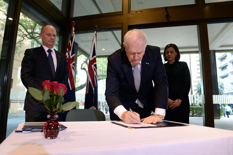 Queensland Premier Campbell Newman (left), watches the Consul for the Netherlands in Brisbane Captain Kasper Kuiper as he signs a condolence book for the victims of Malaysian MH17 in Brisbane, Tuesday, July 22, 2014. Up to 39 Australian citizens and residents have died in the MH17 air disaster over Ukraine. Queensland Premier Campbell Newman (left), watches the Consul for the Netherlands in Brisbane Captain Kasper Kuiper as he signs a condolence book for the victims of Malaysian MH17 in Brisbane, Tuesday, July 22, 2014. Up to 39 Australian citizens and residents have died in the MH17 air disaster over Ukraine.