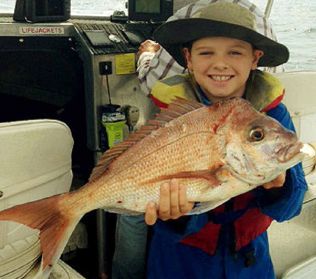 HAPPY TIMES: Thomas Branigan, from Kholo, caught his snapper off Moreton Island. HAPPY TIMES: Thomas Branigan, from Kholo, caught his snapper off Moreton Island.