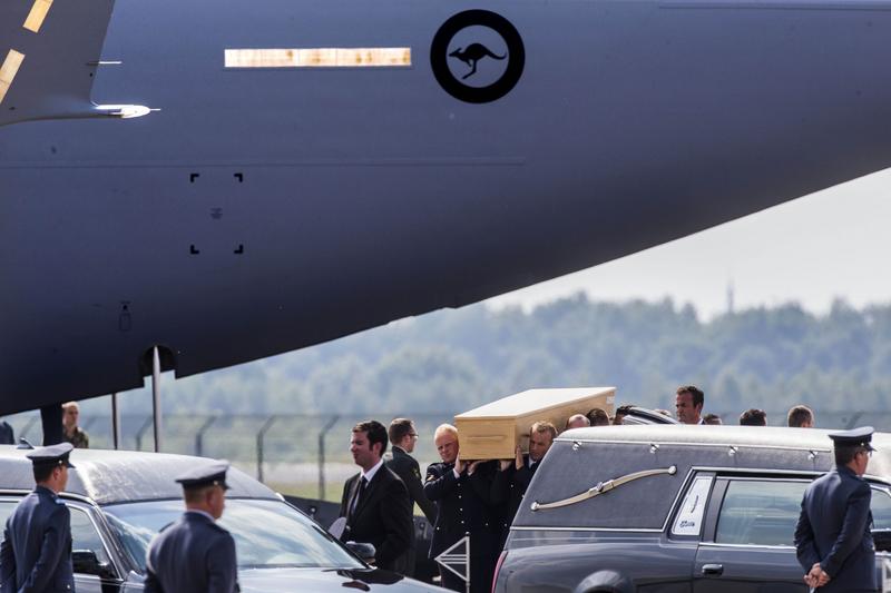 Soldiers carry coffins with the remains of the victims of the MH17 plane crash at Eindhoven military airport July 26, 2014. It is the fourth day that Dutch and Australian transport airplanes brought the remains from Charkov to the Netherlands, where the identification process will take place. Malaysia Airlines Boeing 777 flight MH17 with more than 280 passengers. Soldiers carry coffins with the remains of the victims of the MH17 plane crash at Eindhoven military airport July 26, 2014. It is the fourth day that Dutch and Australian transport airplanes brought the remains from Charkov to the Netherlands, where the identification process will take place. Malaysia Airlines Boeing 777 flight MH17 with more than 280 passengers.