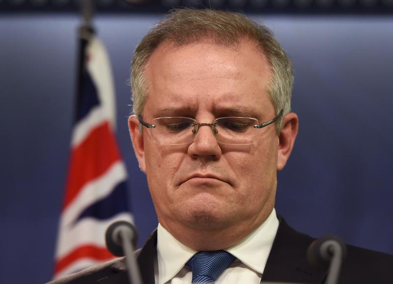 Australian Immigration Minister Scott Morrison announces at a press conference in Sydney on July 25, 2014, that a group of 157 asylum-seekers in custody on the high seas for weeks will be taken to Australia and held until consular officials confirm their nationalities. Australian Immigration Minister Scott Morrison announces at a press conference in Sydney on July 25, 2014, that a group of 157 asylum-seekers in custody on the high seas for weeks will be taken to Australia and held until consular officials confirm their nationalities.