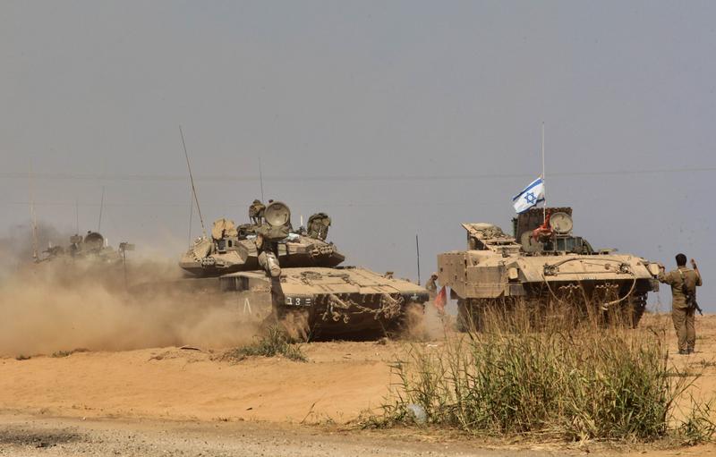 Israeli Merkava tanks take position at an army deployment along the Israeli border with the Hamas-controlled Gaza Strip on July 27, 2014. The Islamist Hamas movement belatedly accepted diplomatic calls for an extension of a humanitarian ceasefire in Gaza shortly after Israel said it was resuming its devastating military assault. Israeli Merkava tanks take position at an army deployment along the Israeli border with the Hamas-controlled Gaza Strip on July 27, 2014. The Islamist Hamas movement belatedly accepted diplomatic calls for an extension of a humanitarian ceasefire in Gaza shortly after Israel said it was resuming its devastating military assault.
