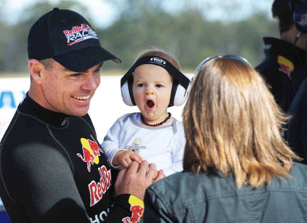 TIME OUT: Harrison Downes with V8 supercar driver Craig Lowndes during a break in testing at Queensland Raceway. TIME OUT: Harrison Downes with V8 supercar driver Craig Lowndes during a break in testing at Queensland Raceway.