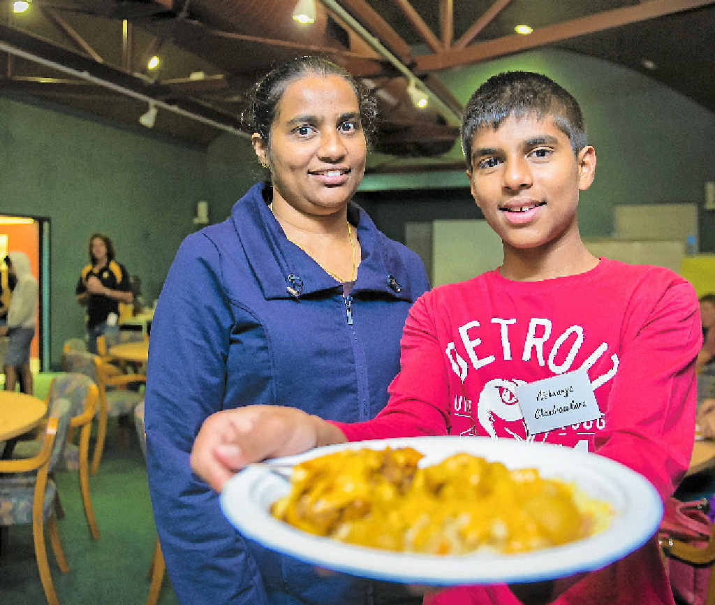 Aish Chandrasekara, 14, with mother Shyamalie Chandrasekara enjoyed the multicultural dinner. Aish Chandrasekara, 14, with mother Shyamalie Chandrasekara enjoyed the multicultural dinner.