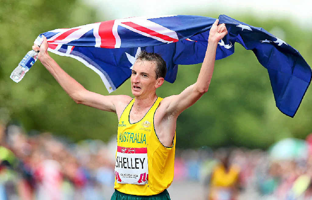 FLYING THE FLAG: Michael Shelley celebrates after winning the men’s marathon in Glasgow. PHOTO: Alex Livesey/Getty Images