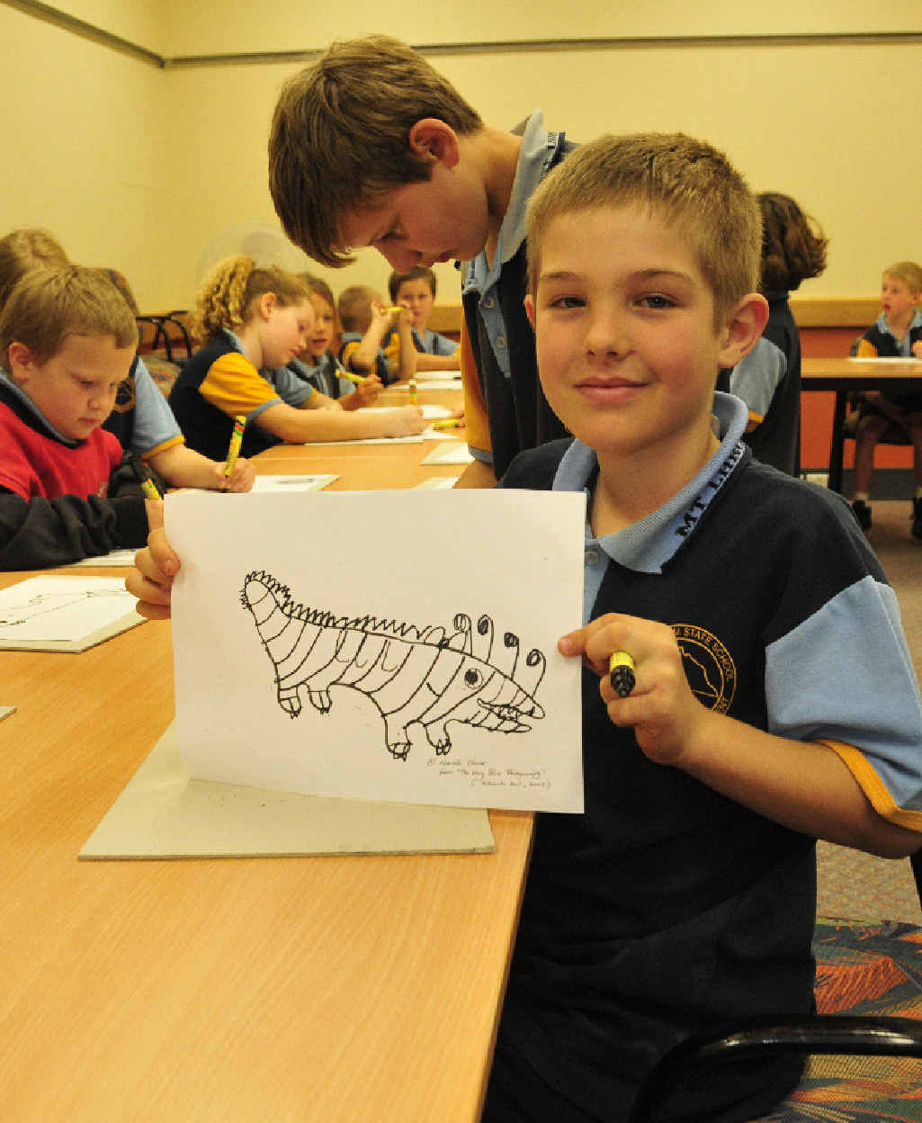 IT’S A THINGAMAJIG: Jon-Alan Smith, 8, from Mount Larcom State School with artwork he made at the Curtis Coast Literary Carnivale. IT’S A THINGAMAJIG: Jon-Alan Smith, 8, from Mount Larcom State School with artwork he made at the Curtis Coast Literary Carnivale.
