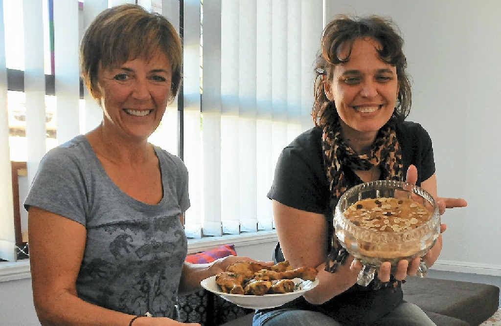 Sarah Bell and Mareika Holmes learn to cook curry the traditional way at an Indian cooking session in Clinton. Sarah Bell and Mareika Holmes learn to cook curry the traditional way at an Indian cooking session in Clinton.