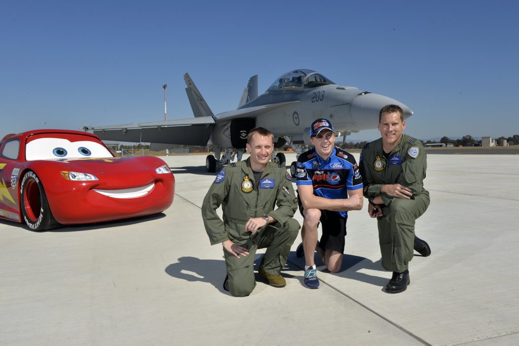 AT THE READY: V8 Supercars Championship leader Mark Winterbottom with Flight Lieutenant Robert Cousland and Flight Lieutenant Dave Murphy. 