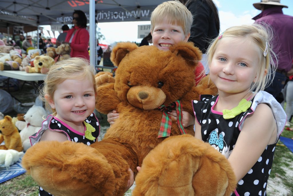 Amelia, 3, and Lydia, 7, Robertson and Isaac, 7, Reed with Big Bear at Condy Park's Teddy Bears Picnic. Amelia, 3, and Lydia, 7, Robertson and Isaac, 7, Reed with Big Bear at Condy Park's Teddy Bears Picnic.