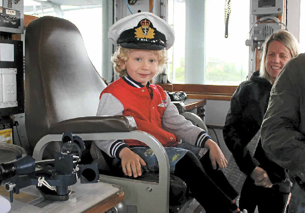YOUNG SKIPPER: Owen Hooper, 4, from Ballina takes over the captain’s seat on HMAS Labuan. YOUNG SKIPPER: Owen Hooper, 4, from Ballina takes over the captain’s seat on HMAS Labuan.