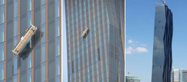 Two window cleaners were trapped 144 metres up from the ground on the 48th floor in front of the 'DC-Tower,' Austria's highest skyscraper Two window cleaners were trapped 144 metres up from the ground on the 48th floor in front of the 'DC-Tower,' Austria's highest skyscraper