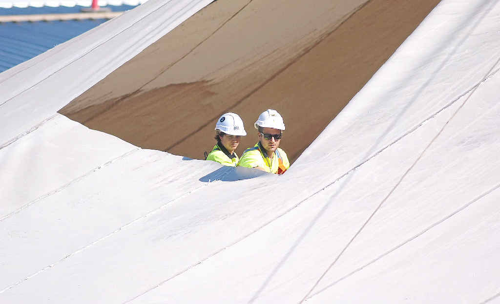 SAIL AWAY: Workers help take down the Big Top’s iconic shade sails in preparation for the next stage of the redevelopment and, inset, the centre in the beginning in 1986. SAIL AWAY: Workers help take down the Big Top’s iconic shade sails in preparation for the next stage of the redevelopment and, inset, the centre in the beginning in 1986.