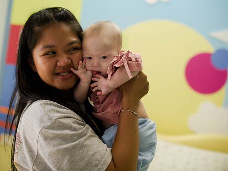 Thai surrogate mother Pattaramon Chanbua holds baby Gammy Thai surrogate mother Pattaramon Chanbua holds baby Gammy