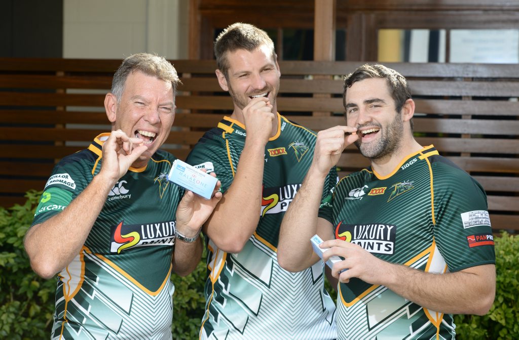 YUM: Ipswich Jets CEO Wayne Wendt and players Rob Worsley and Josh Seage take malaria tablets before their trip to PNG. YUM: Ipswich Jets CEO Wayne Wendt and players Rob Worsley and Josh Seage take malaria tablets before their trip to PNG.