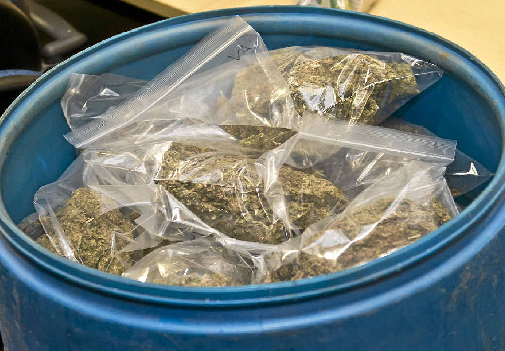 HAUL: Detective Inspector Mick Dowie with the seized drugs and money at Toowoomba Police Station yesterday. HAUL: Detective Inspector Mick Dowie with the seized drugs and money at Toowoomba Police Station yesterday.