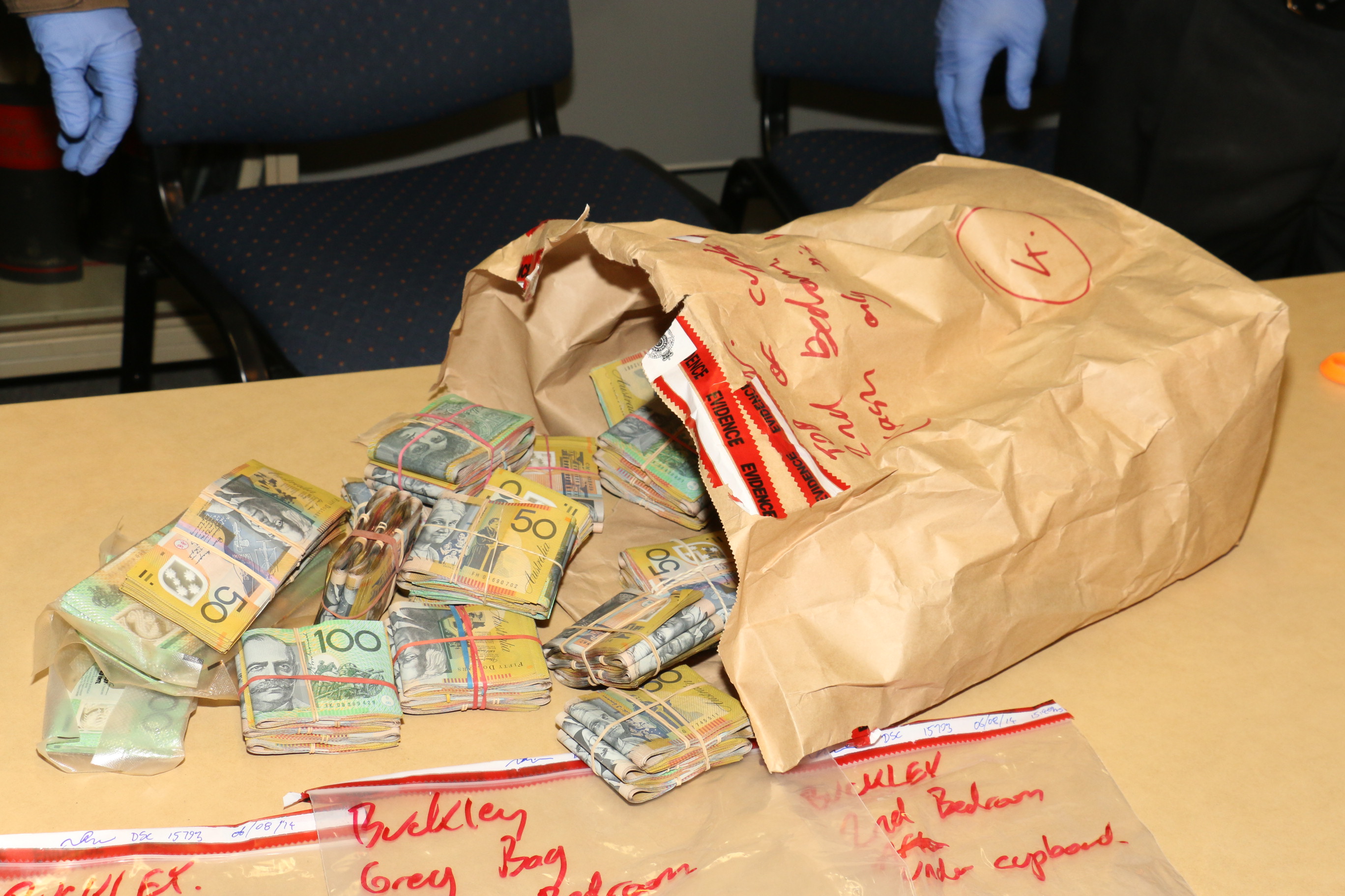 Up to $300,000 in cash was found by police when they raided properties at Warwick. Up to $300,000 in cash was found by police when they raided properties at Warwick.
