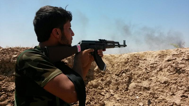 A soldier with the Kurdish Peshmerga forces aims with his rifle during fighting with Islamic State (IS) fighters, in Amerly town, northeastern Baghdad, Iraq, 07 August 2014. A soldier with the Kurdish Peshmerga forces aims with his rifle during fighting with Islamic State (IS) fighters, in Amerly town, northeastern Baghdad, Iraq, 07 August 2014.