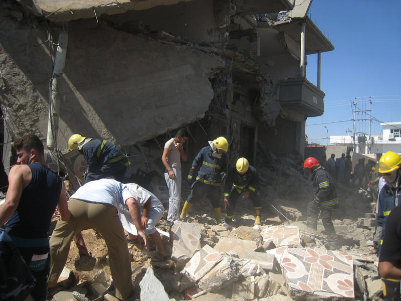 Firefighters look for survivors at the site of a double car bomb attack took place in Kirkuk, 180 miles (290 kilometers) north of Baghdad, Iraq, Thursday, Aug. 7, 2014. Firefighters look for survivors at the site of a double car bomb attack took place in Kirkuk, 180 miles (290 kilometers) north of Baghdad, Iraq, Thursday, Aug. 7, 2014.