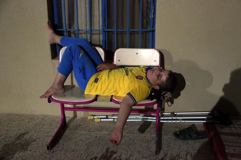 A displaced Iraqi Christian boy sleeps on a chair as he settles with his family at St. Joseph Church in Irbil, northern Iraq, Thursday, Aug. 7, 2014. A displaced Iraqi Christian boy sleeps on a chair as he settles with his family at St. Joseph Church in Irbil, northern Iraq, Thursday, Aug. 7, 2014.