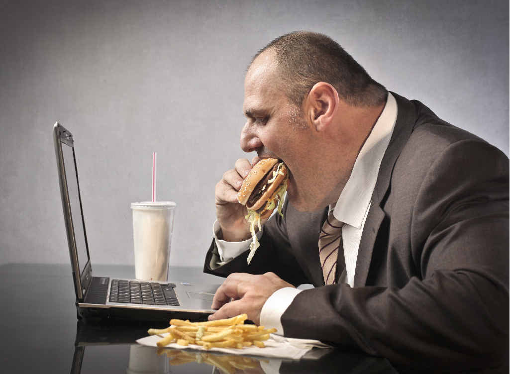 LUNCHTIME: Munching away at your desk? A prescription could put a stop to that, with research suggesting doctors should be able to limit the amount office workers sit down during the day. LUNCHTIME: Munching away at your desk? A prescription could put a stop to that, with research suggesting doctors should be able to limit the amount office workers sit down during the day.