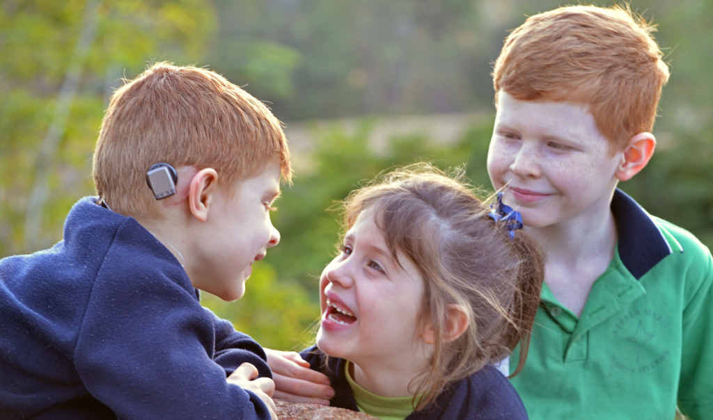 YOU DON’T SAY: Ronan Bell swaps gossip with his proud twin sister Eilish and and brother Rory thanks to a ground-breaking bone-conducting hearing aid. YOU DON’T SAY: Ronan Bell swaps gossip with his proud twin sister Eilish and and brother Rory thanks to a ground-breaking bone-conducting hearing aid.