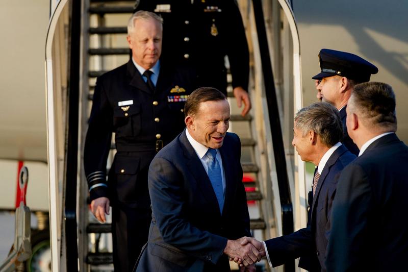 Australian Prime Minister Tony Abbott (C) is welcomed upon arrival at the Airport in Rotterdam, The Netherlands, 10 August 2014. Australian Prime Minister Tony Abbott (C) is welcomed upon arrival at the Airport in Rotterdam, The Netherlands, 10 August 2014.