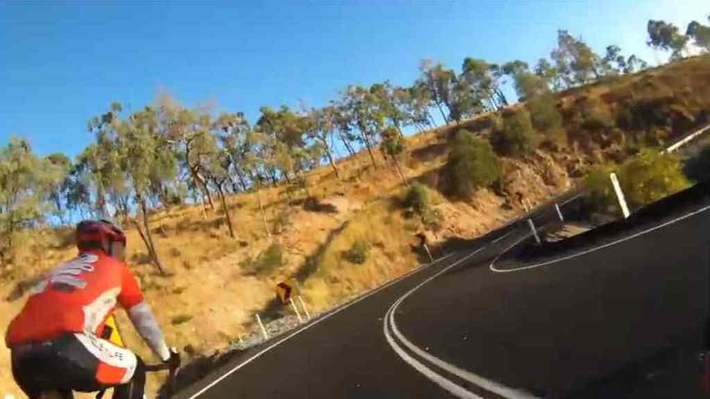 Still of video of cyclist overtaking others over double white lines going down Mt Morgan Range Still of video of cyclist overtaking others over double white lines going down Mt Morgan Range