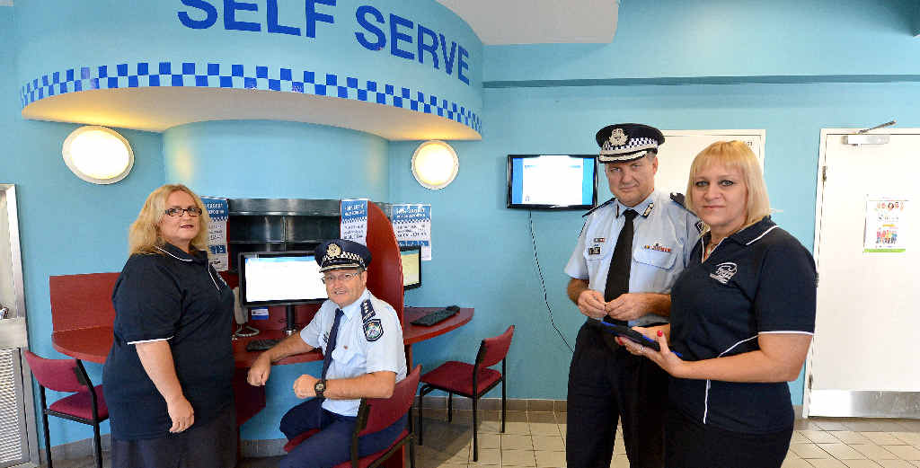 STATE FIRST: Mackay Police administration officer Stancia Guthrie, Inspector Andy Graham, Assistant Commissioner Mike Condon and administration officer Linda Fielder try out the new information kiosk at Mackay police Station. STATE FIRST: Mackay Police administration officer Stancia Guthrie, Inspector Andy Graham, Assistant Commissioner Mike Condon and administration officer Linda Fielder try out the new information kiosk at Mackay police Station.