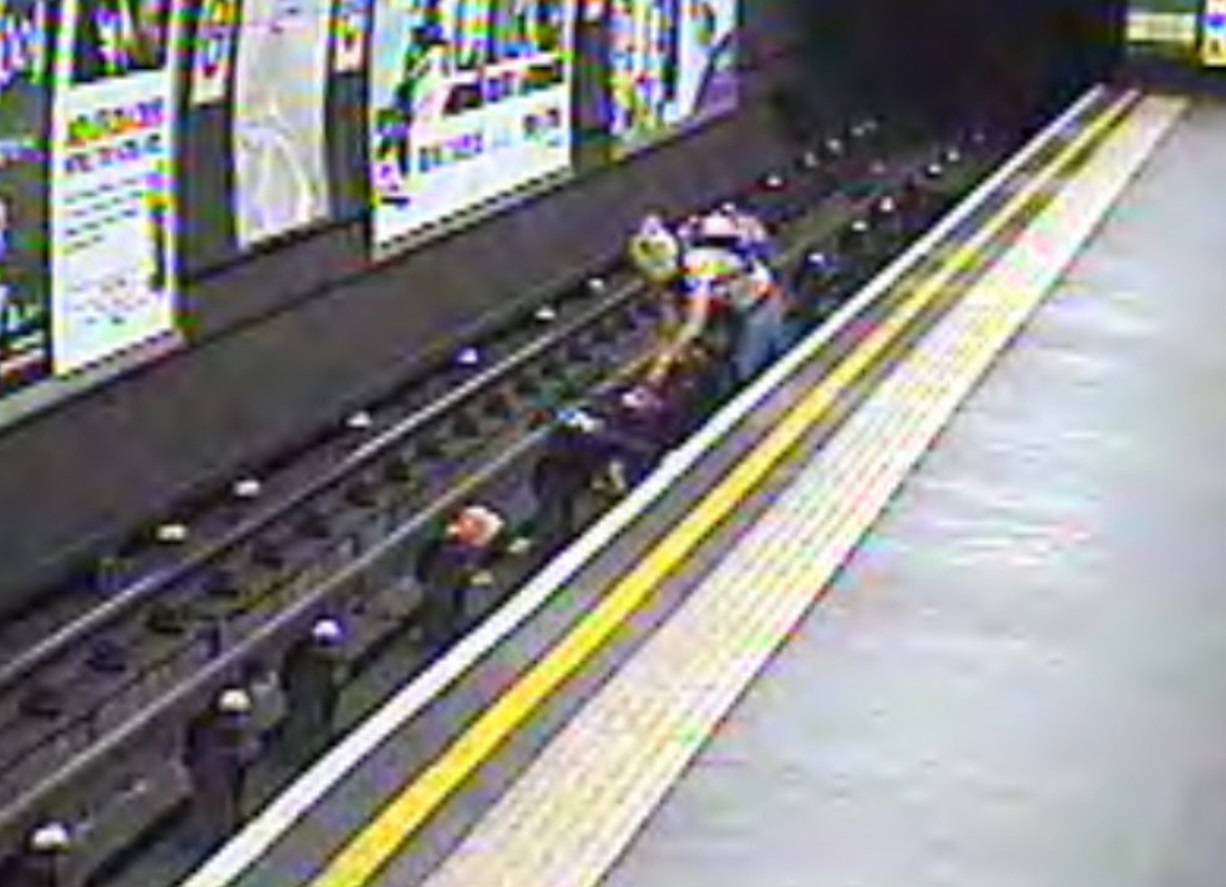 The buggy and the child's mother on the tracks - in the short gap between one train leaving and another arriving The buggy and the child's mother on the tracks - in the short gap between one train leaving and another arriving
