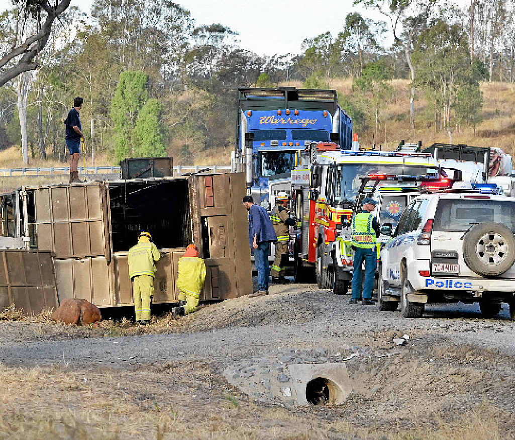 RIGHT: The scene of the truck roll-over on the Wide Bay Hwy yesterday afternoon. RIGHT: The scene of the truck roll-over on the Wide Bay Hwy yesterday afternoon.