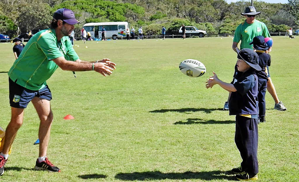 CATCHING ON: NRL community officer Kel Menchin and friend pass the ball at the Multi Sports Day at Lennox Head. CATCHING ON: NRL community officer Kel Menchin and friend pass the ball at the Multi Sports Day at Lennox Head.