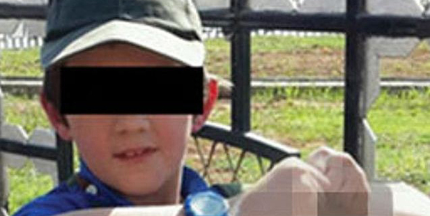 The photo Khaled Sharrouf posted to Twitter of his Australian-born son in Syria, posing with severed heads. The photo Khaled Sharrouf posted to Twitter of his Australian-born son in Syria, posing with severed heads.