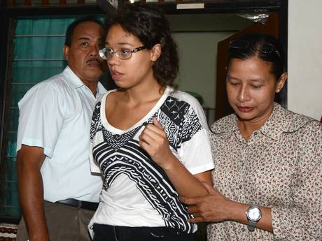 A police officer escorts suspect Lois Heather Mack, 19, during an investigation at a police office in Nusa Dua on Indonesian resort island of Bali A police officer escorts suspect Lois Heather Mack, 19, during an investigation at a police office in Nusa Dua on Indonesian resort island of Bali