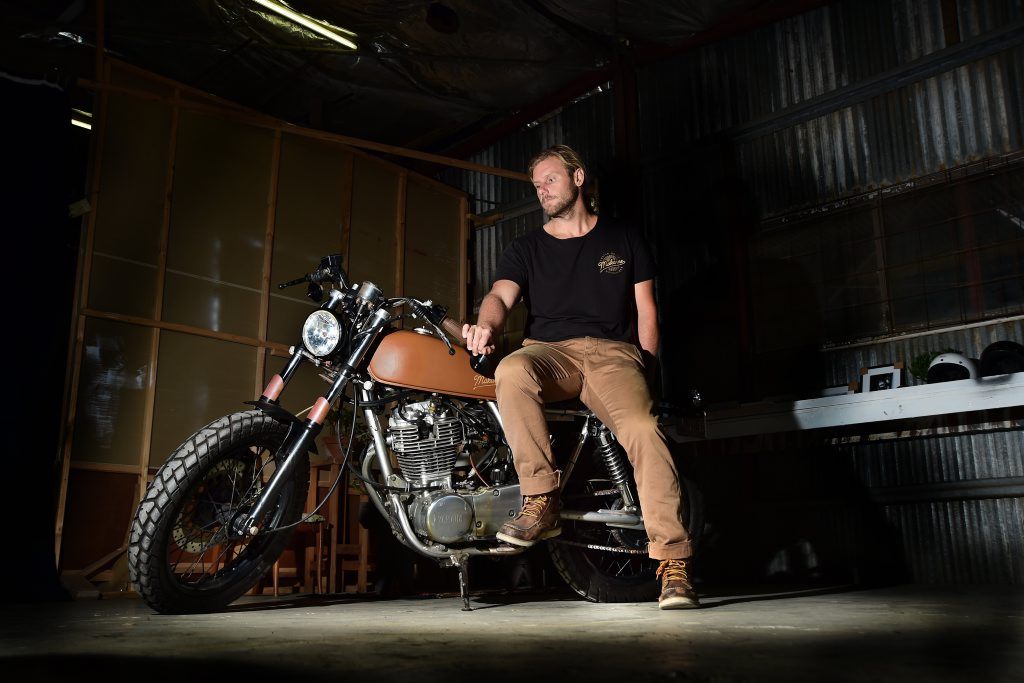 Anthony Mackenzie with one of his creations, a 2001 Yamaha SR400 Custom known as The Duke Anthony Mackenzie with one of his creations, a 2001 Yamaha SR400 Custom known as The Duke