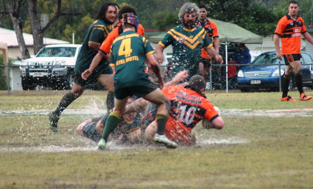 Image for sale: The Tiger*s Josh Allan is taken down in the centre of the field in a fight where only the brave ventured. Photo Noel Thompson / South Burnett Times