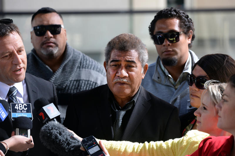 Tau Taufa (centre) and other family members look on as their spokesman Louie Naumovski speaks to the media outside the Magistrates Court during a break in proceedings in Brisbane, Monday, Aug. 18, 2014. Mr Taufa gave evidence to a coronial inquiry into the Slacks Creek house fire which claimed the lives of eleven people from two families on August 24, 2011. Tau Taufa (centre) and other family members look on as their spokesman Louie Naumovski speaks to the media outside the Magistrates Court during a break in proceedings in Brisbane, Monday, Aug. 18, 2014. Mr Taufa gave evidence to a coronial inquiry into the Slacks Creek house fire which claimed the lives of eleven people from two families on August 24, 2011.