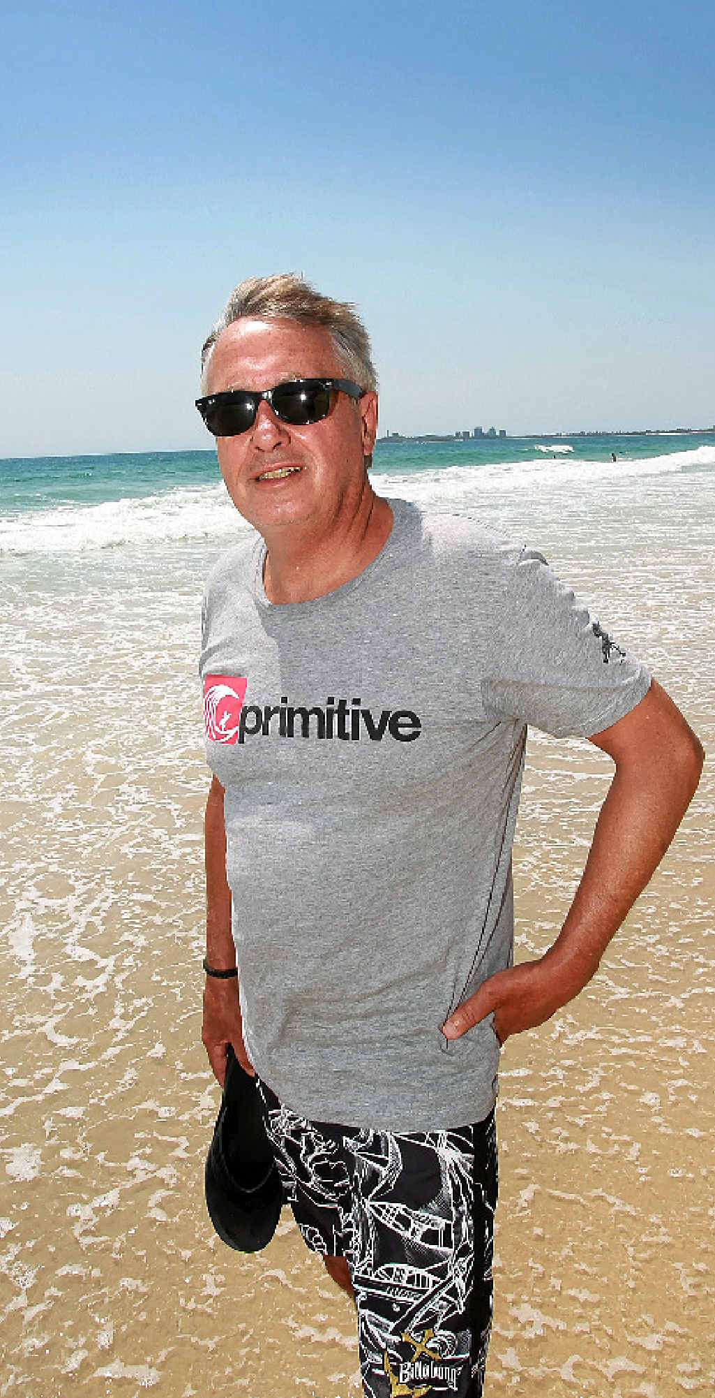 SPIRITUAL HOME: Wayne Swan wets his toes on a scorcher of a day at Maroochydore Beach. SPIRITUAL HOME: Wayne Swan wets his toes on a scorcher of a day at Maroochydore Beach.