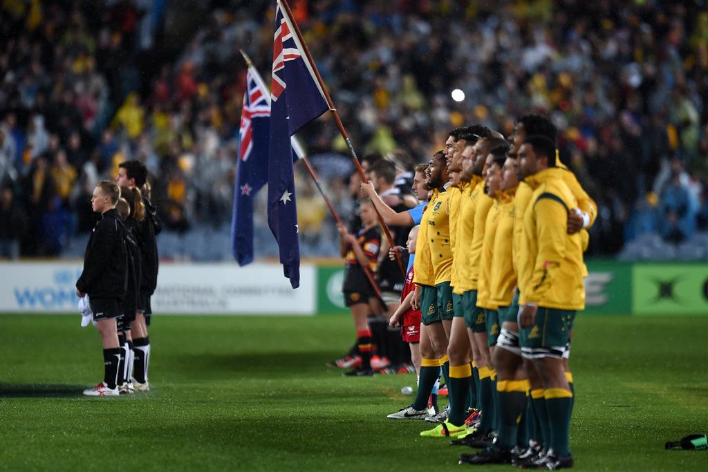 THANK YOU BALL BOY: Sam Carroll, in the Redmen shirt, sings the National Anthem with the Wallabies just before Saturday’s Bledisloe Cup game. Photo: AAP Paul Miller. THANK YOU BALL BOY: Sam Carroll, in the Redmen shirt, sings the National Anthem with the Wallabies just before Saturday’s Bledisloe Cup game. Photo: AAP Paul Miller.