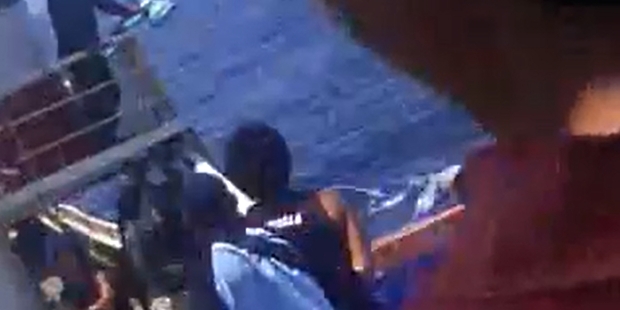 The video appears to have been filmed from the deck of a large vessel. The video appears to have been filmed from the deck of a large vessel.