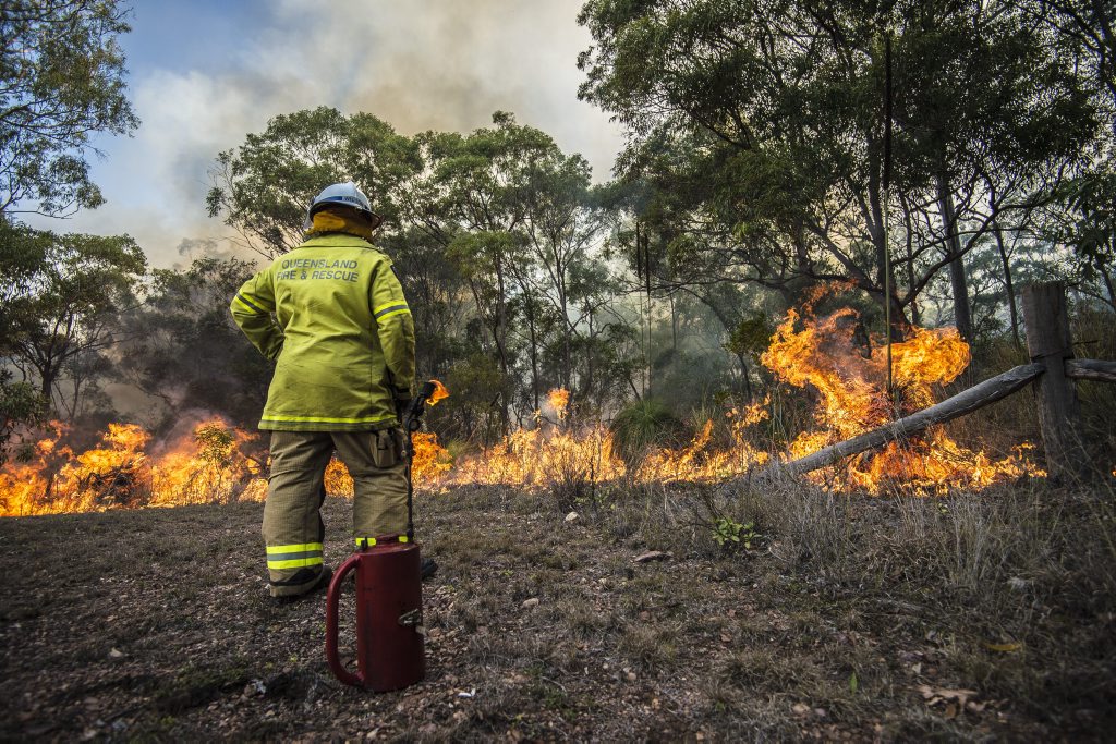BACKBURNING: Calliope 243A fire fighter Scott Wilson conducting backburning operations on a Beecher property in 2014 (file photo). BACKBURNING: Calliope 243A fire fighter Scott Wilson conducting backburning operations on a Beecher property in 2014 (file photo).