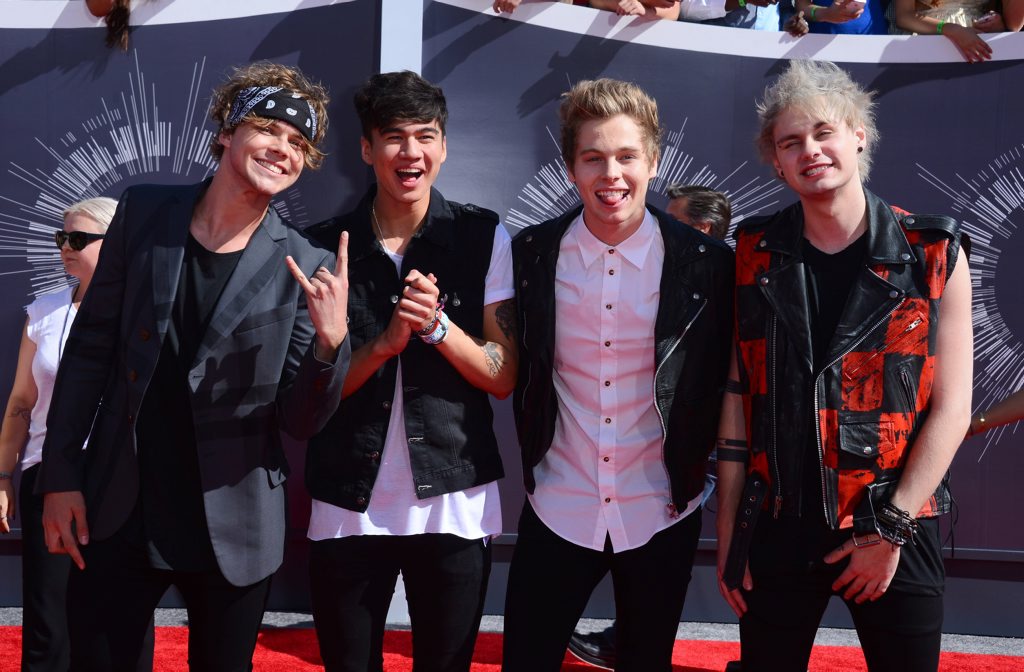 Ashton Irwin, from left, Calum Hood, Luke Hemmings and Michael Clifford of 5 Seconds of Summer arrive at the MTV Video Music Awards at The Forum in Inglewood, California. Ashton Irwin, from left, Calum Hood, Luke Hemmings and Michael Clifford of 5 Seconds of Summer arrive at the MTV Video Music Awards at The Forum in Inglewood, California.