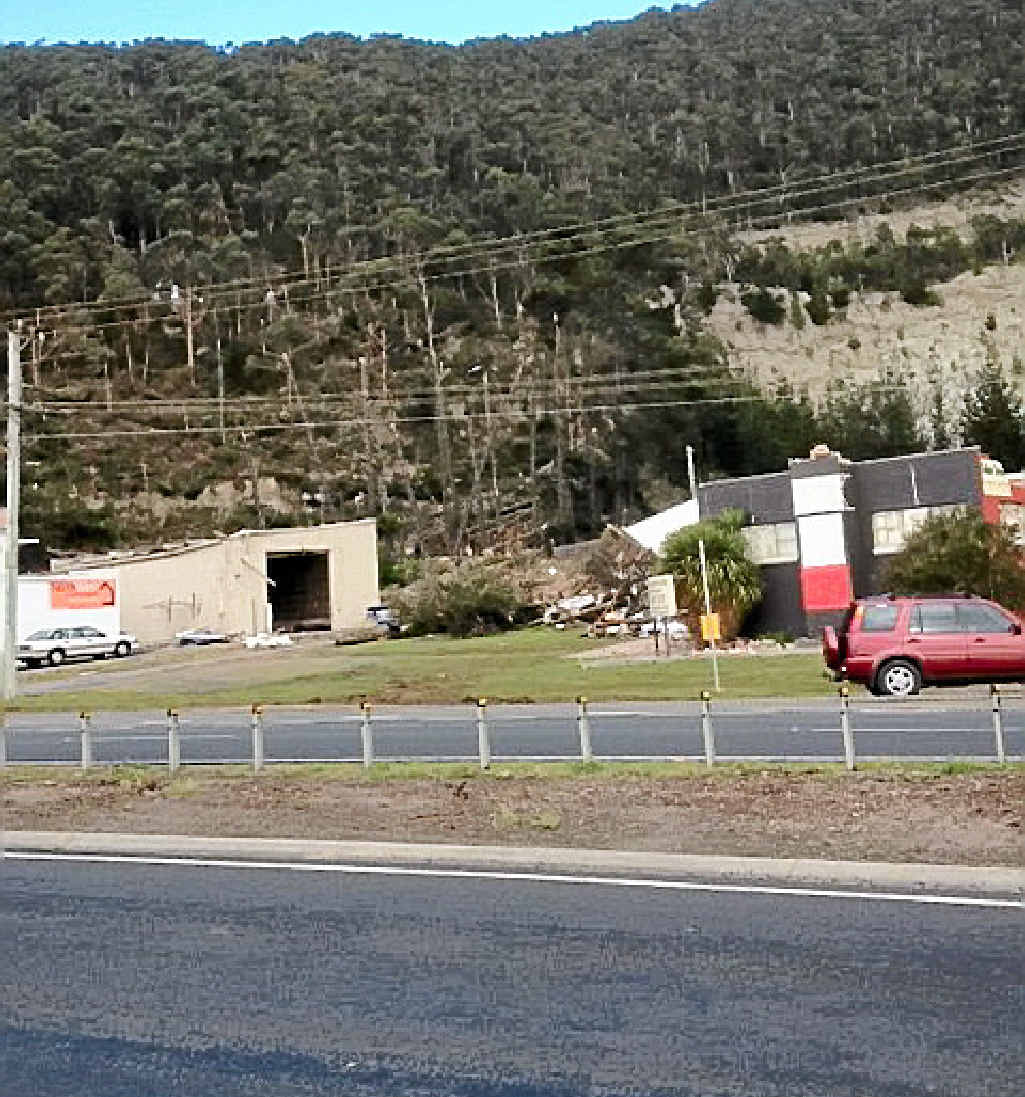 GONE: This pic of a blown-off roof at coastal Burnie beside Tasmania’s Bass Highway was submitted by a driver. GONE: This pic of a blown-off roof at coastal Burnie beside Tasmania’s Bass Highway was submitted by a driver.