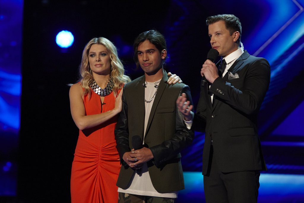 Sydney singer Adrien Nookadu, 17, pictured during his elimination from The X Factor with mentor Natalie Bassingthwaighte, left, and host Luke Jacobz. Sydney singer Adrien Nookadu, 17, pictured during his elimination from The X Factor with mentor Natalie Bassingthwaighte, left, and host Luke Jacobz.