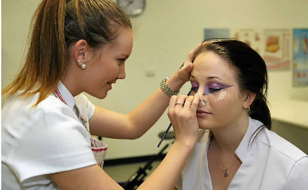 LOVING IT: Shannae Keiler applies avant-garde make-up to Chloe Eckert, as part of the CQUniversity beauty therapy students’ photographic make-up assessment. LOVING IT: Shannae Keiler applies avant-garde make-up to Chloe Eckert, as part of the CQUniversity beauty therapy students’ photographic make-up assessment.