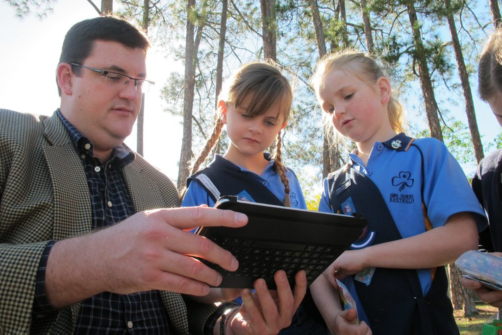 Natural Resources Minister Andrew Cripps demonstrates the new QTopo program to Queensland Girl Guides Jo (left) and Jemma. Natural Resources Minister Andrew Cripps demonstrates the new QTopo program to Queensland Girl Guides Jo (left) and Jemma.