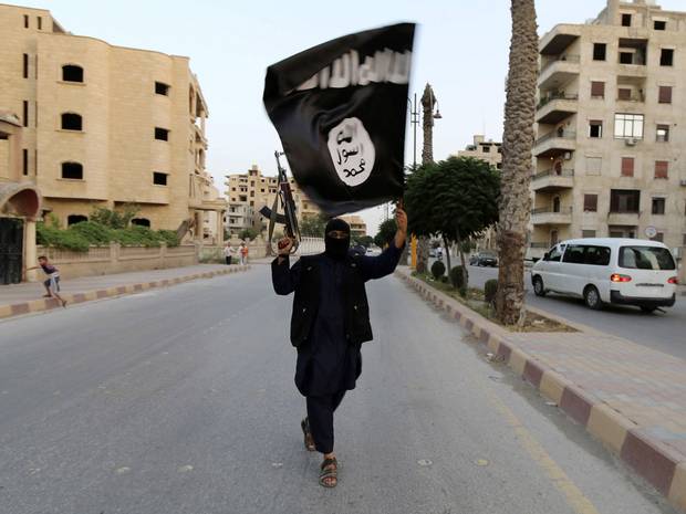 Man flying the Islamic State flag Man flying the Islamic State flag