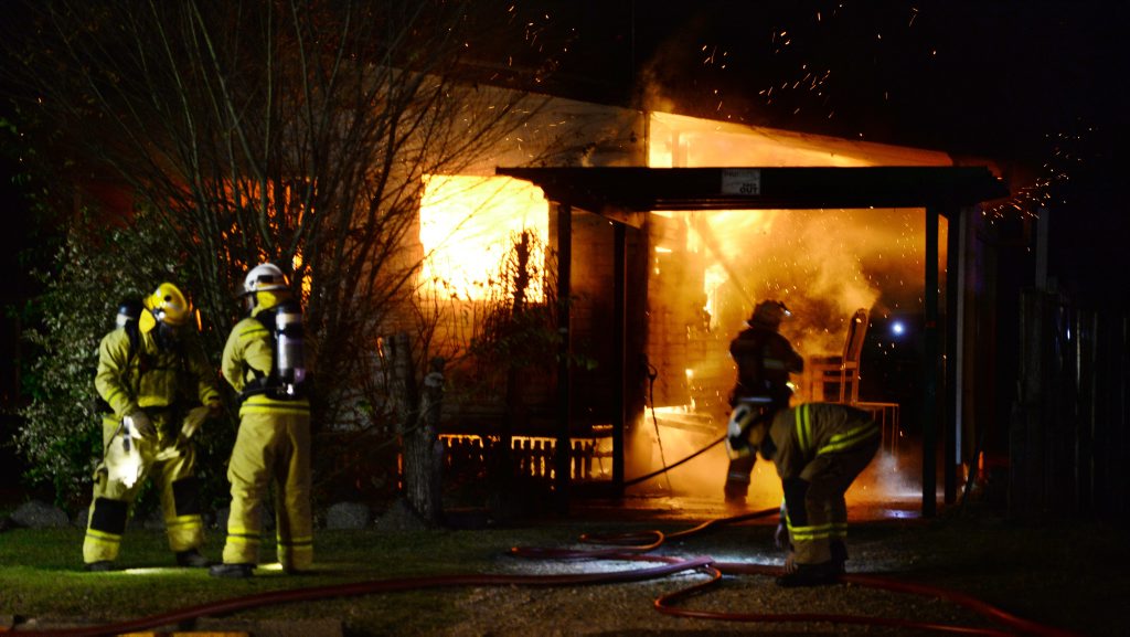 Fire fighters tackle a blaze at a house on Chubb Street in One Mile early Monday morning. Photo: Rob Williams / The Queensland Times Fire fighters tackle a blaze at a house on Chubb Street in One Mile early Monday morning. Photo: Rob Williams / The Queensland Times
