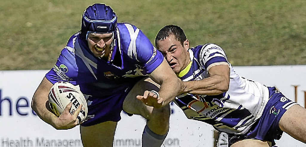 GO FORWARD: Valleys player Rick Gibson forges ahead during the reserves grand final. GO FORWARD: Valleys player Rick Gibson forges ahead during the reserves grand final.